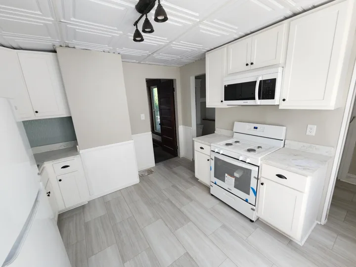 Fixr-Up: White kitchen cabinetry and updated flooring