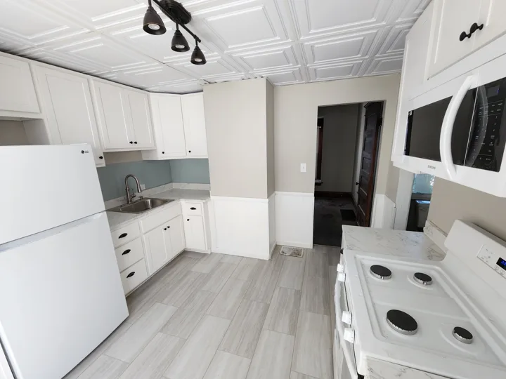 Fixr-Up: Renovated kitchen with white appliances